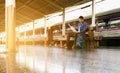 Man sitting at train station and looking on map for travel planning. Royalty Free Stock Photo