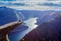 Man sitting on trolltunga in norway Royalty Free Stock Photo