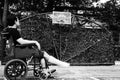 Man sitting on wheel chair with broken leg