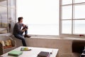 Man Sitting At Window And Looking At Beautiful Beach View Royalty Free Stock Photo