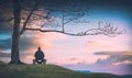 Man sitting on a wooden bench. Instagram stylization