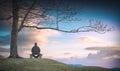 Man sitting on a wooden bench. Instagram stylization Royalty Free Stock Photo