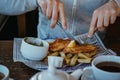 Man sitting at the wooden table, eating fish and chips. Royalty Free Stock Photo