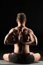 Man sitting in yoga position