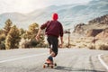 Man skateboarding at mountain road Royalty Free Stock Photo