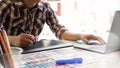Man sketch on digital tablet with pen, Graphic designer working on creative workspace