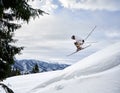 Man skier skiing downhill in snowy mountains. Royalty Free Stock Photo
