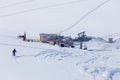 Man skiing grom hill to ski stantion in mountain of Caucasus, Gudauri Royalty Free Stock Photo