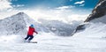 Man skiing on the prepared slope with fresh new powder snow in A Royalty Free Stock Photo