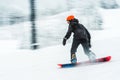 A man skiing snow board very fast. blurred picture.