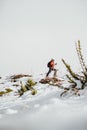 Man skiing uphill in the mountain