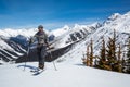 Man skiing uphill near the Asulkan Glacier in Roger`s Pass area of Glacier National Park, Canada. Skier going uphill skinning,