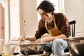 Handsome stylish man creating pottery in Royalty Free Stock Photo