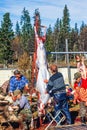 Man skinning a reindeer at slaughter