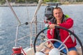 Man skipper steers boat sailing yacht on the sea. Sport. Royalty Free Stock Photo