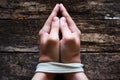 Man slave prays with his hands tied Royalty Free Stock Photo