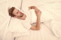 Man sleep in bed. early morning wakeup. man sleeping white bedroom. cosy weekend at home. time to relax. guy fall asleep Royalty Free Stock Photo