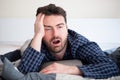 Man with sleep disorder lying in the bed Royalty Free Stock Photo