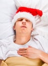 Man sleep in the Santa Hat