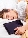 Man sleep with a Tablet Royalty Free Stock Photo