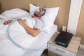 Man With Sleeping Apnea And CPAP Machine Royalty Free Stock Photo