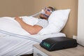 Man With Sleeping Apnea And CPAP Machine Royalty Free Stock Photo