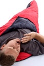 Man in sleeping bag and yawning Royalty Free Stock Photo