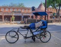 Man sleeping on bicycle