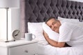 Man sleeping on comfortable pillow in bed Royalty Free Stock Photo