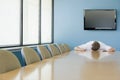 Man sleeping on conference table Royalty Free Stock Photo