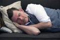 Man sleeping on couch Royalty Free Stock Photo