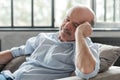 Man sleeping on couch, taking afternoon nap at the living room Royalty Free Stock Photo