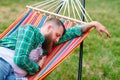 The man is sleeping on a hammock. Royalty Free Stock Photo