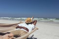 Man sleeping on hammock at beach Royalty Free Stock Photo