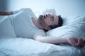 Man sleeping in his bed and snoring loudly Royalty Free Stock Photo