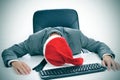 Man sleeping in the office after a christmas party Royalty Free Stock Photo