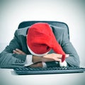 Man sleeping in the office after a christmas party Royalty Free Stock Photo