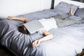 Man sleeping over laptop computer in bed Royalty Free Stock Photo