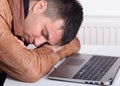 Man sleeping over laptop Royalty Free Stock Photo