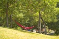 Man sleeping in a red hammock Royalty Free Stock Photo