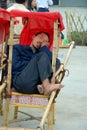 Man sleeping in a sedan chair, Zhangjiajie National Forest Park, China