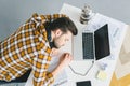 Man sleeping on table with laptop Royalty Free Stock Photo