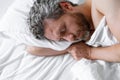 Man sleeps in bed. Sleep and nap. Snore sleepy napping wake up. Mattress pillow bed. Slumber overslept. Morning sleep Royalty Free Stock Photo