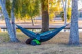 Man Sleeps in Hammock