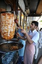 Man slices doner kebab