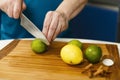 Man slicing limes and lemons Royalty Free Stock Photo