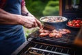 man slicing sirloin steak on a barbecue grill Royalty Free Stock Photo