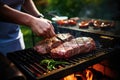 man slicing sirloin steak on a barbecue grill Royalty Free Stock Photo