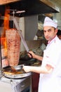 Man slicing turkish doner kebab kebap in Istanbul Turkey. Royalty Free Stock Photo