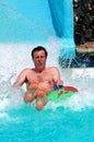 Man on slide at waterpark